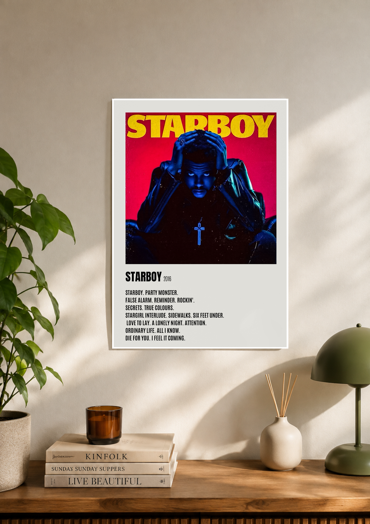 The Weeknd Starboy poster with red cross motif on blue