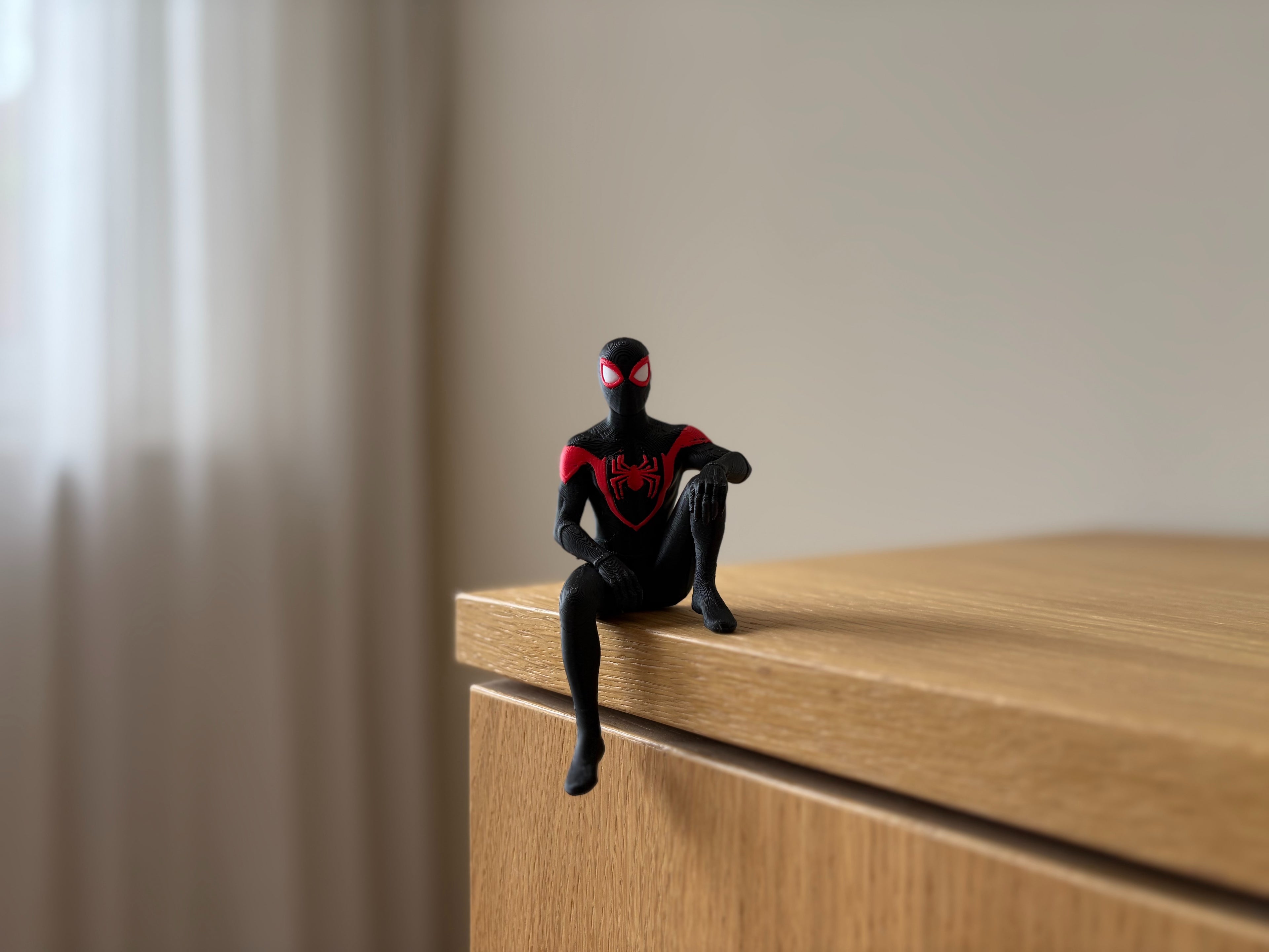 PosterBay MakerHub™ Spider-Man Sitting Shelf Figure – Black & Red Suit Desk Edge Sitter