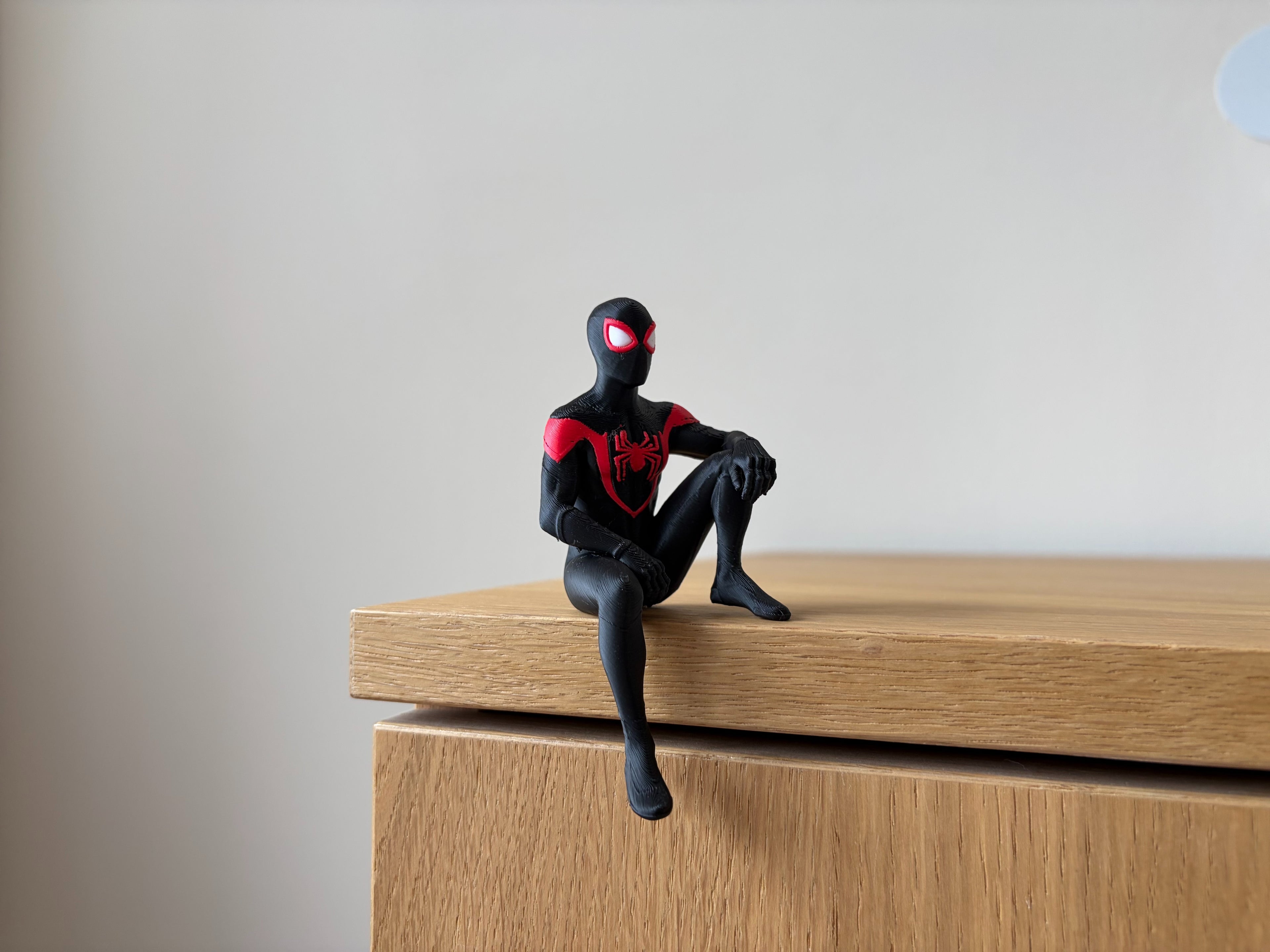 PosterBay MakerHub™ Spider-Man Sitting Shelf Figure – Black & Red Suit Desk Edge Sitter