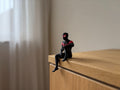 PosterBay MakerHub™ Spider-Man Sitting Shelf Figure – Black & Red Suit Desk Edge Sitter